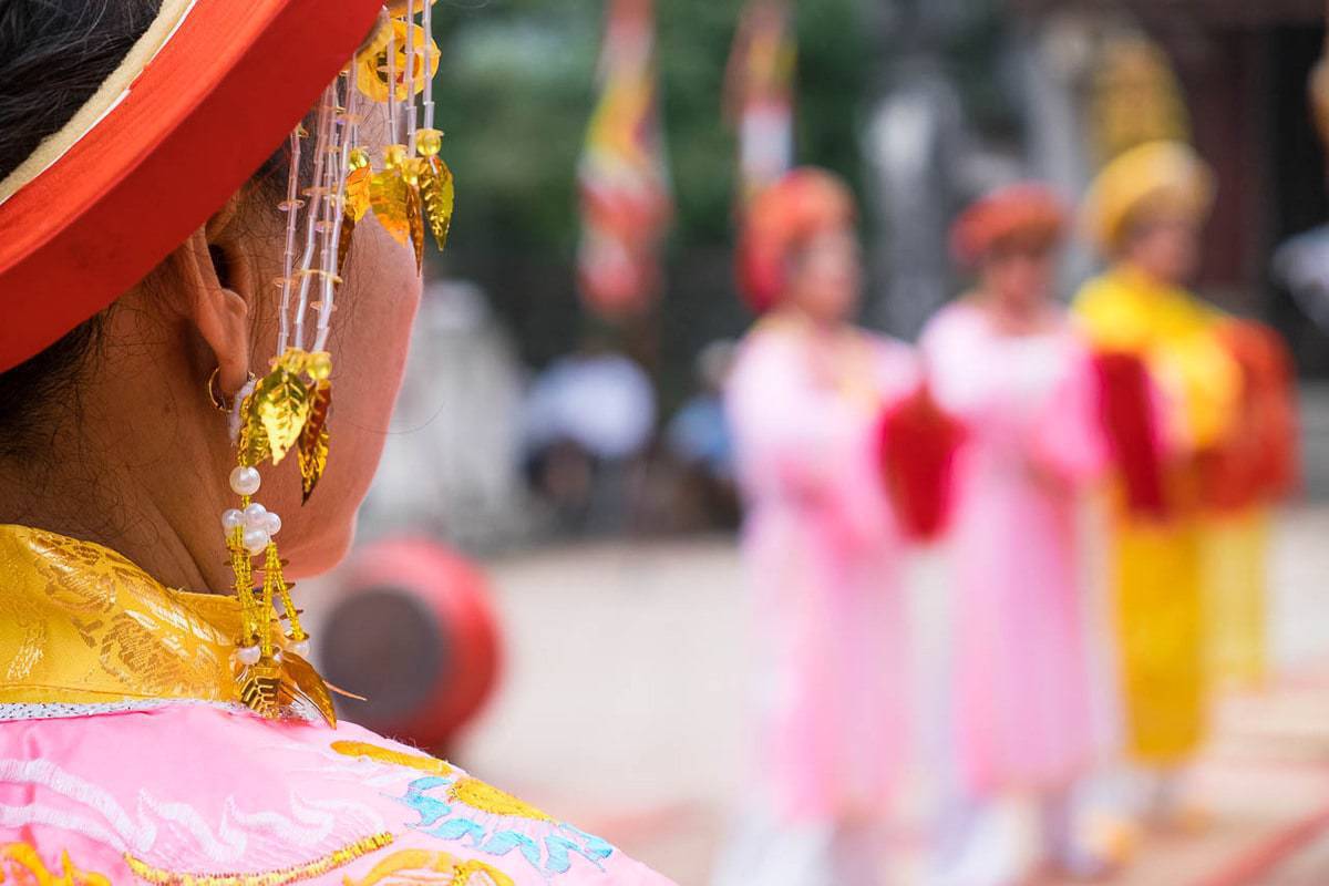 Vietnamese woman ceremonial earring Patio Temple Dinh Hoa Lu Vietnam
