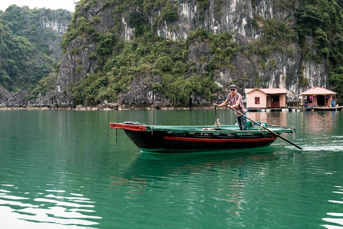 Vietnamese fisherman at the floating village in Halong Bay, Vietnam.
