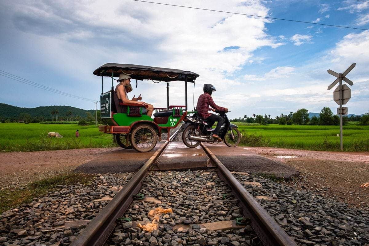 Khmer Tuk-Tuk at a level crossing. Kampot, Cambodia.