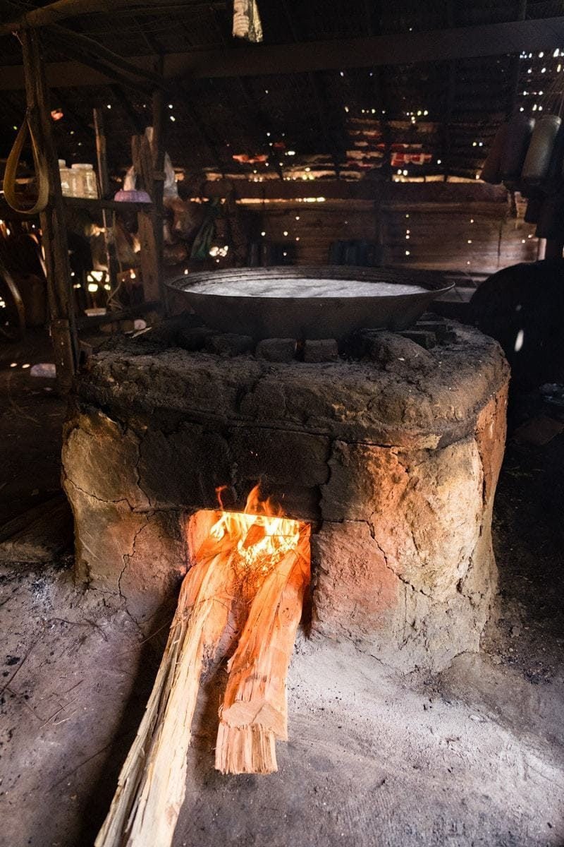 The fire stove with the boiling sap on a big wok.