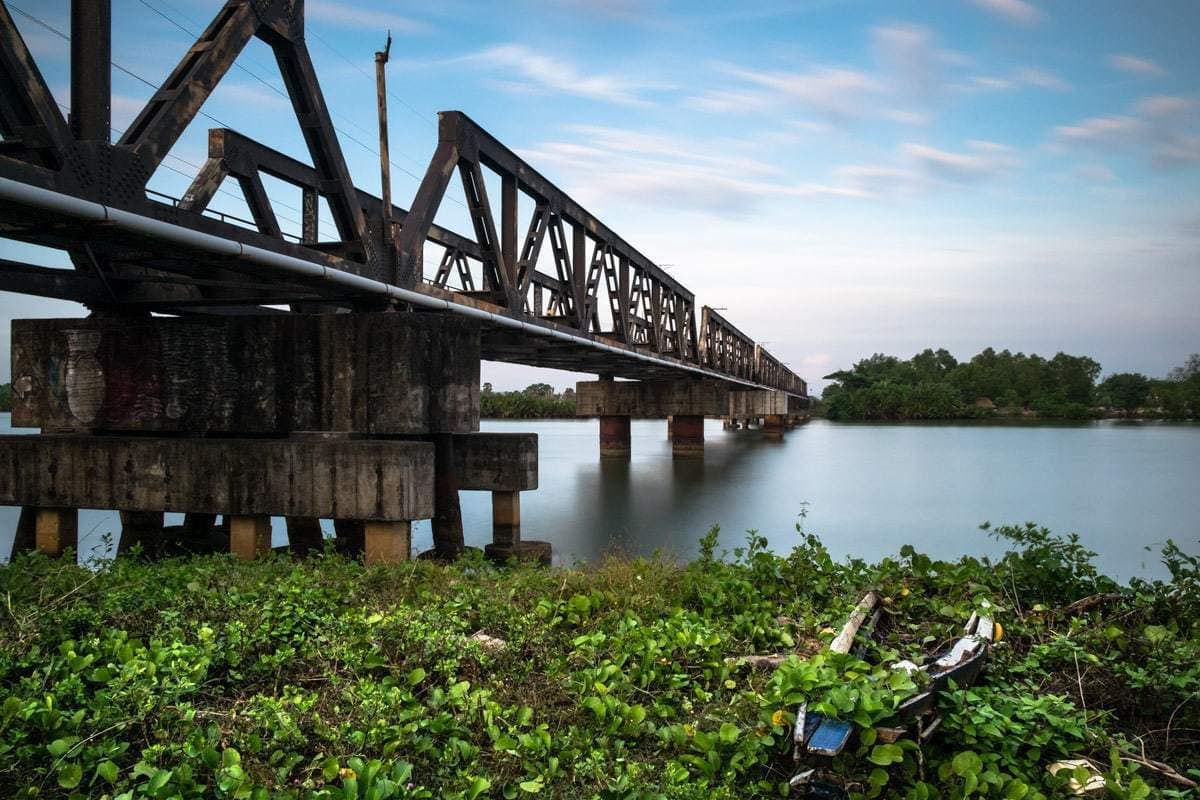 Steel railway bridge over the Kampot River. Kampot, Cambodia.
