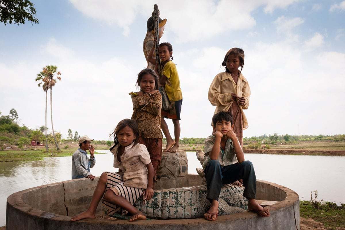 Khmer kids pose spontaneously for my camera in a remote area on the outskirts of the capital city Phnom Penh, Cambodia.