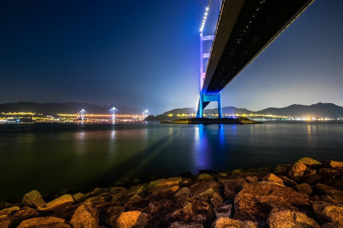Under the Tsing Ma Bridge by night. Ma Wan Island, Hong Kong.