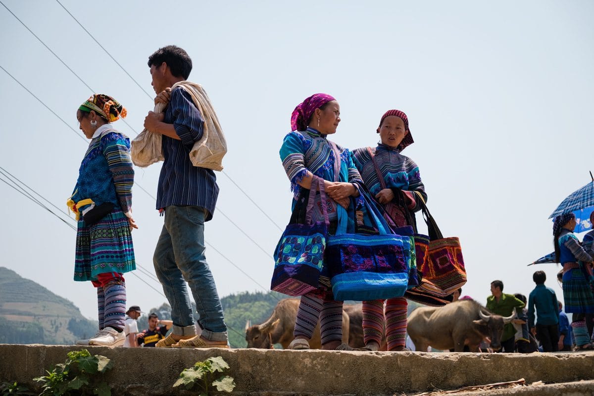 Hill tribe Flower H’Mong people sell handmade bags at the buffalo Bac Ha market, Vietnam.