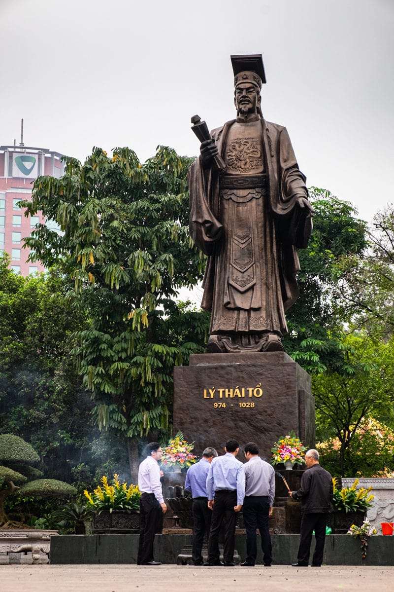 Vietnamese people pay respect to King Ly Thai statue in Hanoi, Vietnam.