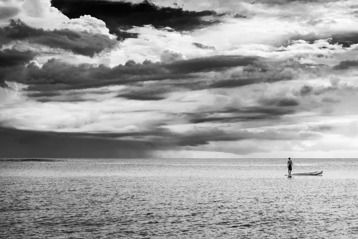 A Black & White image of a fisherman at Senggigi Beach. Lombok Island, Indonesia.