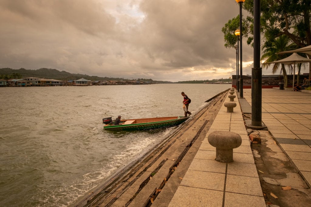 Man takes a taxi boat at the Ferry Terminal. Bandar Seri Begawan waterfront, Brunei.