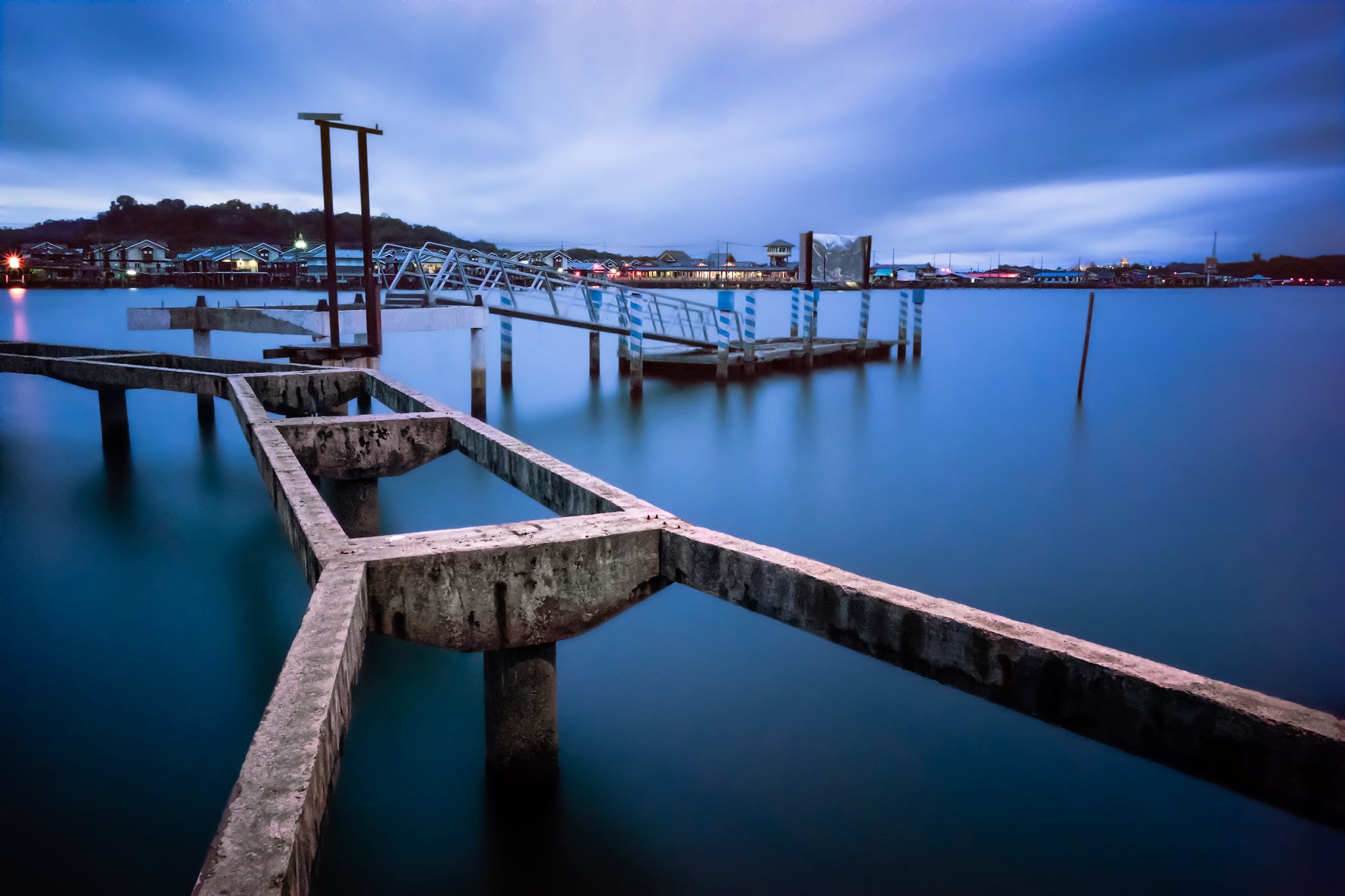 Old pier at the waterfront with silky water because of the long exposure. Bandar Seri Begawan, Brunei.