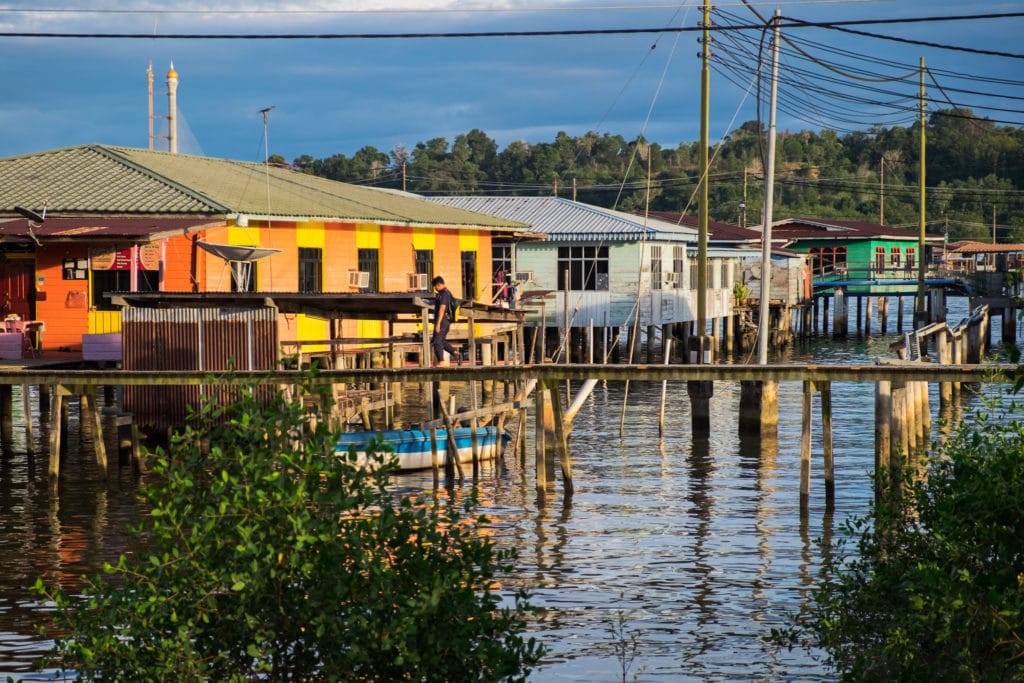A man walks around Kampong Ayer or the Water Village on the Brunei River in Bandar Seri Begawan, Brunei.