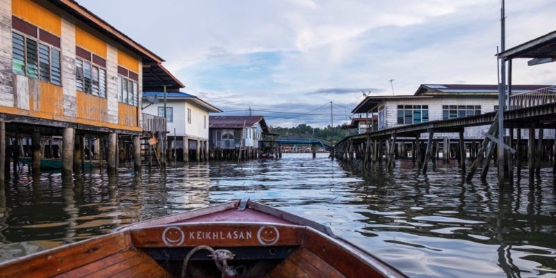 Cruising around Kampong Ayer or the Water Village on the Brunei River in Bandar Seri Begawan, Brunei.