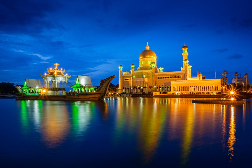 Sultan Omar Ali Saifuddien Mosque in the evening. Bandar Seri Begawan, Brunei. Water of the pond and lights reflection look smooth because of the long exposure.