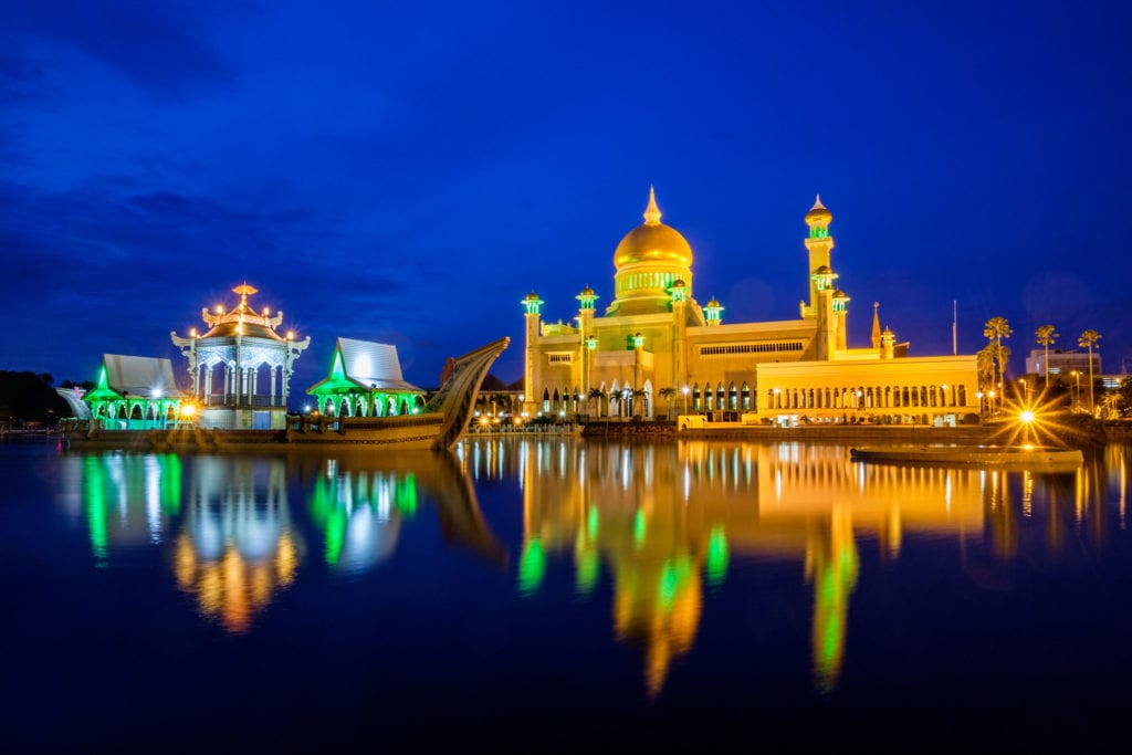 Sultan Omar Ali Saifuddien Mosque in the evening. Bandar Seri Begawan, Brunei. Water of the pond and lights reflection look very silky because of the very long exposure.