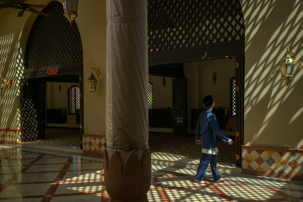 Young follower of Islam at Ash-Shaliheen Mosque. Bandar Seri Begawan, Brunei.