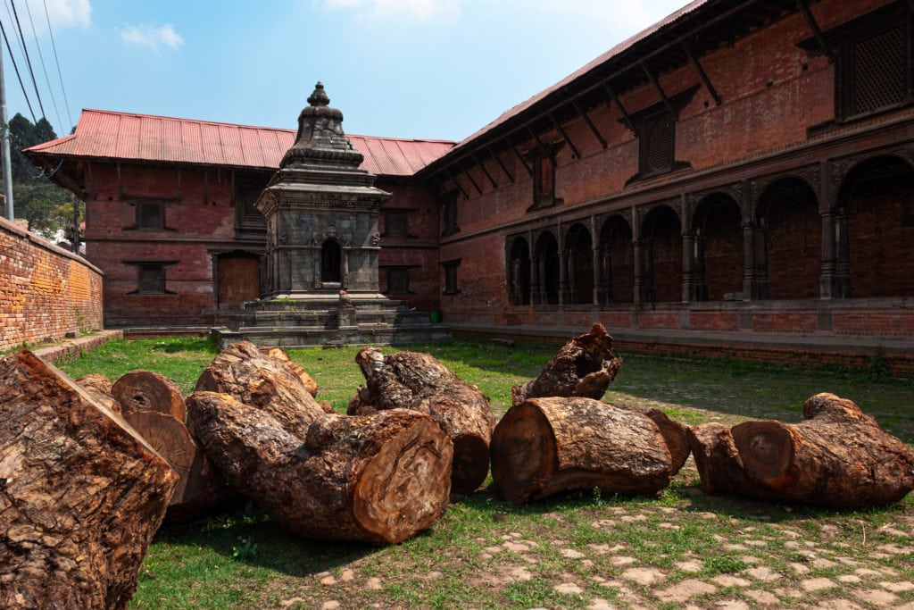 Shrine and wood logs at Pashupatinath Temple. Kathmandu, Nepal.