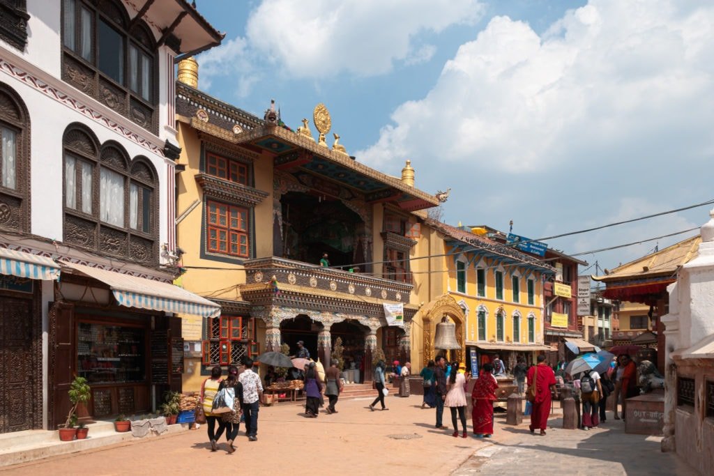 People walk around the Boudhanath Stupa. Kathmandu, Nepal.