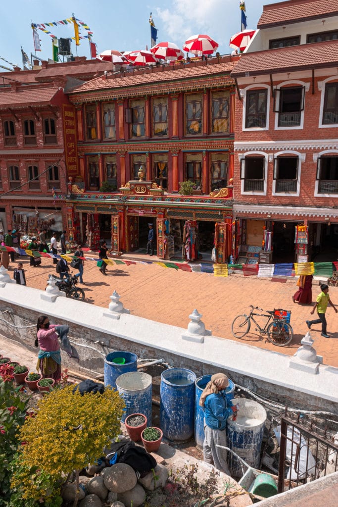 Nepalese workers decorate Boudhanath Stupa. Kathmandu, Nepal.