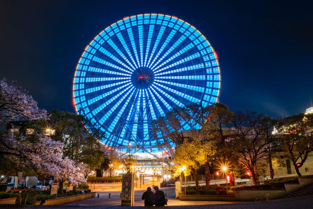 Long exposure of moving Tempozan Ferris Wheel at night. Osaka, Japan.