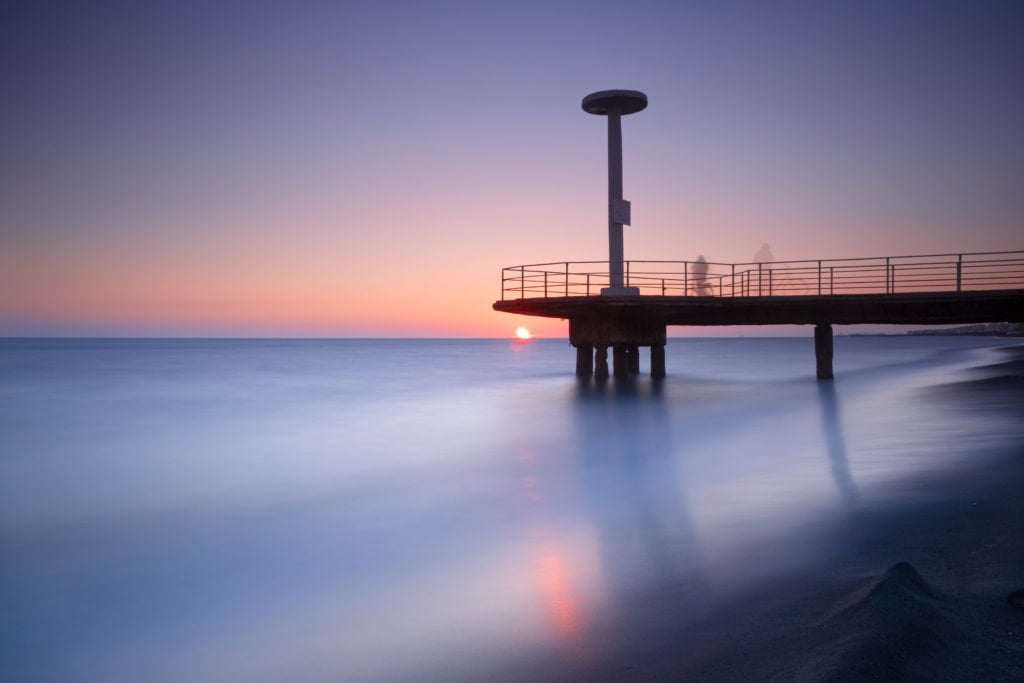 Pontile dello stabilimento Plinius (Plinius' pier) at Lido di Ostia. Rome, Italy. Sea water looks very smooth and silky because of the long exposure.