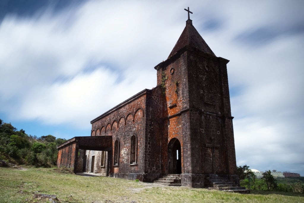 The old French Catholic Church in Kampot, Cambodia. Clouds look smooth and silky because of the long exposure.